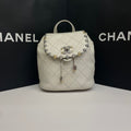 Chanel CC Day Backpack White Quilted Leather Bicolor Studs Gold Hardware