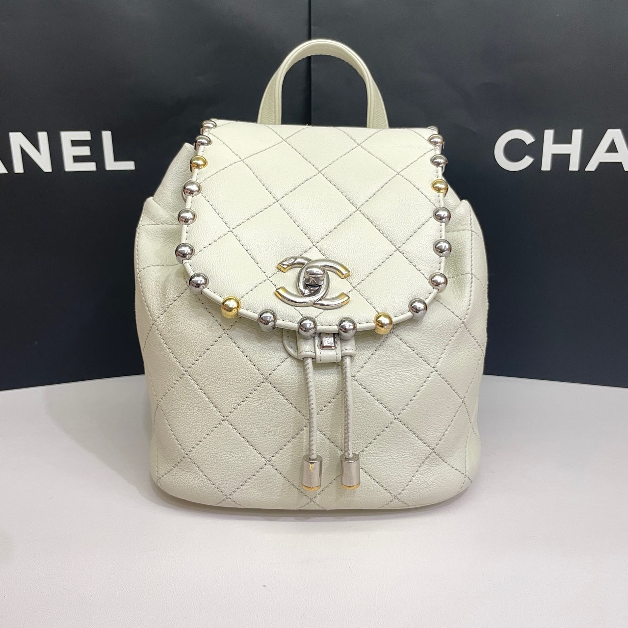Chanel CC Day Backpack White Quilted Leather Bicolor Studs Gold Hardware