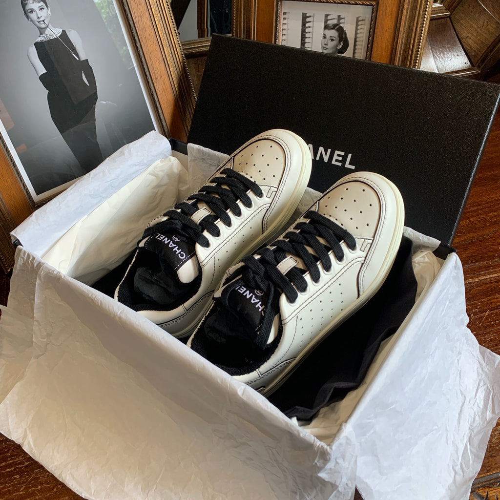 Chanel Low-top Sneakers Off-White Leather Black Laces