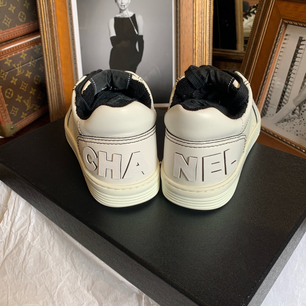 Chanel Low-top Sneakers Off-White Leather Black Laces