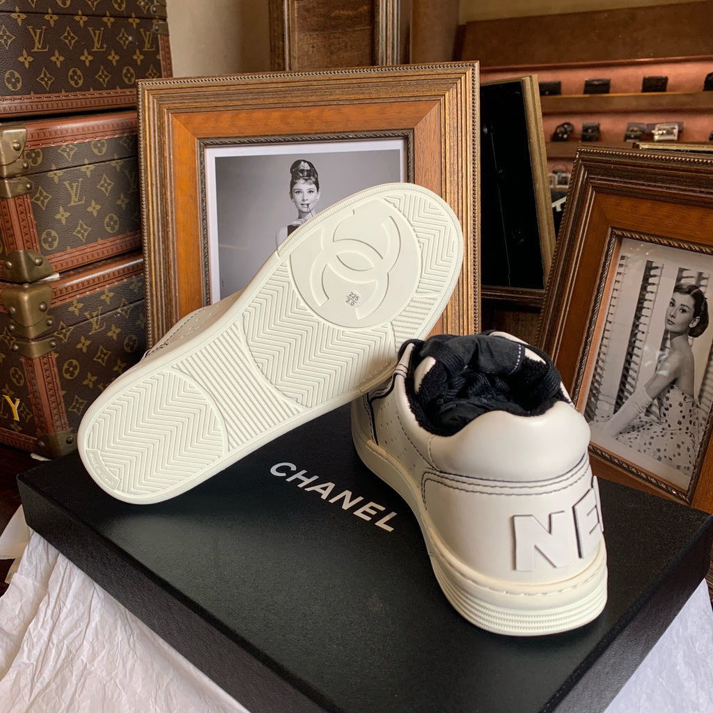 Chanel Low-top Sneakers Off-White Leather Black Laces