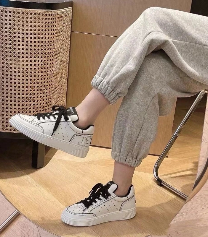 Chanel Low-top Sneakers Off-White Leather Black Laces